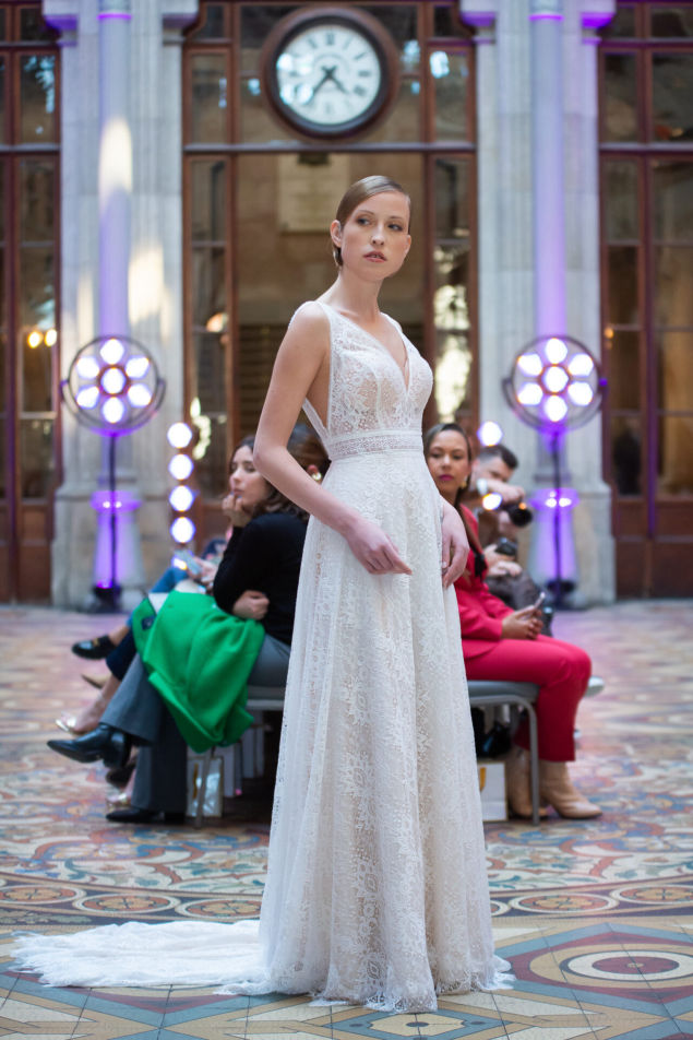 Iryna Berdnyk, runway in a white lace gown