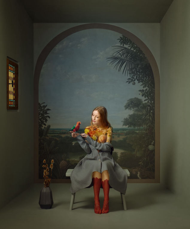 Iryna Berdnyk, painterly editorial with a bird perched on her hand